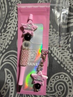 Pink star rhinestone pen with matching phone charm.